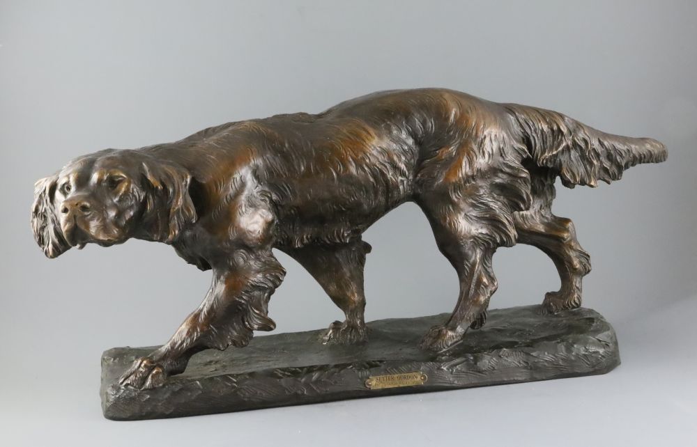 Thomas Francois Cartier (French, 1879-1943). A French bronzed terracotta model of a Gordon Setter, signed, on a naturalistic base,